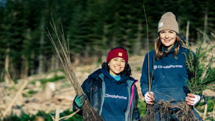 ClimatePartner employees at a tree planting event